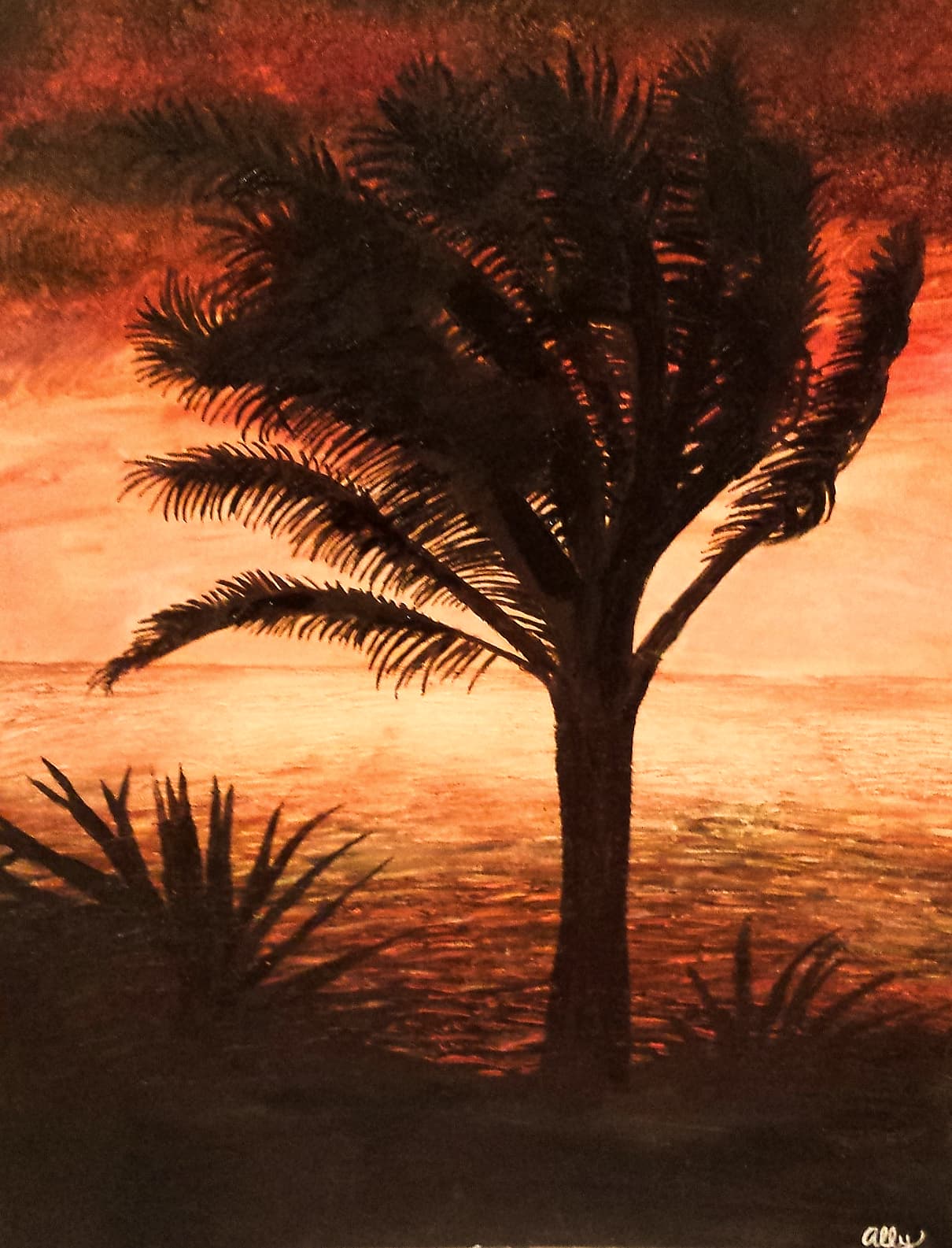 Silhouette of a palm tree against a fiery orange sunset over water, by Ally Nowakowski.